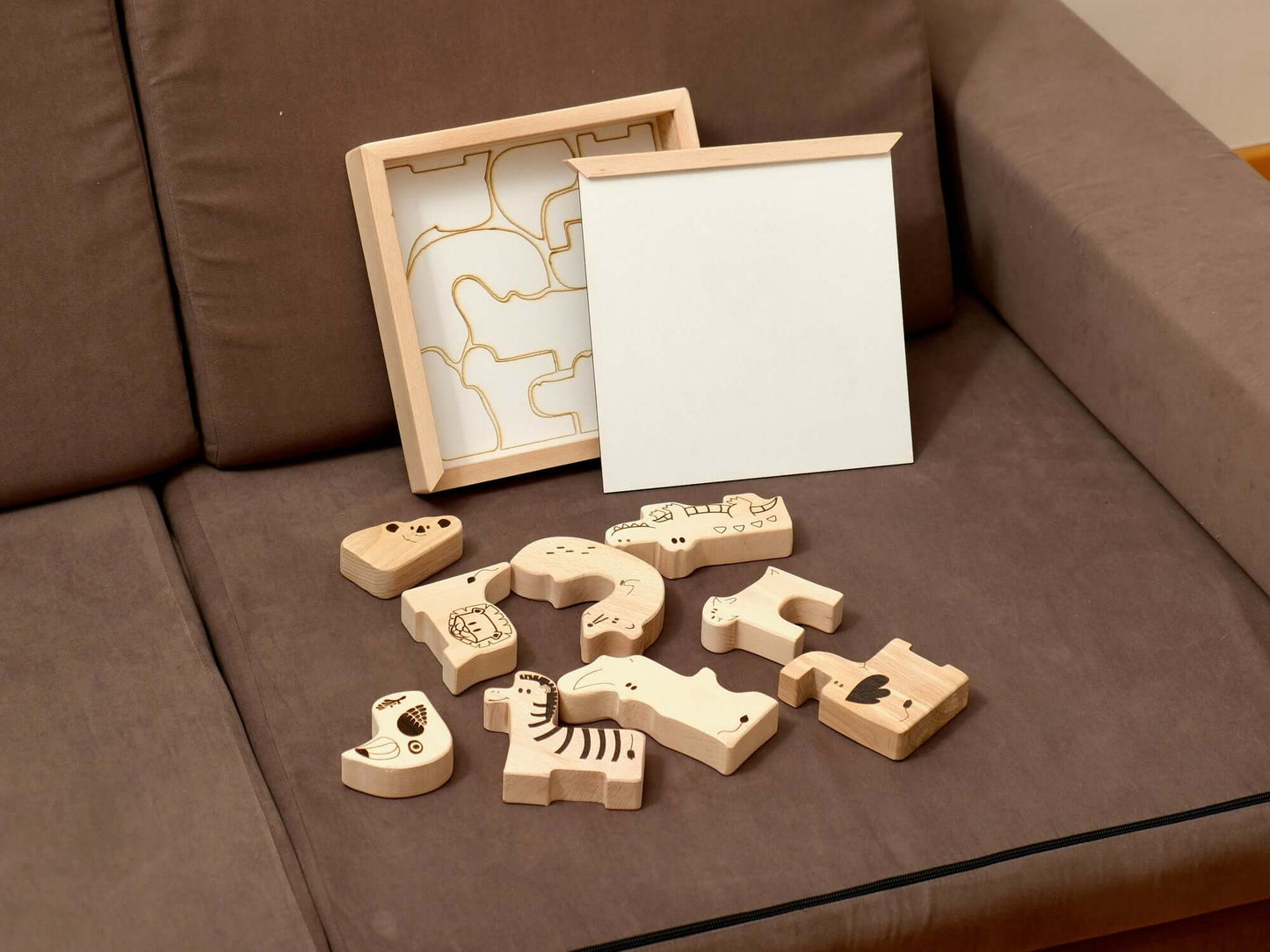 Wooden Safari Animal Puzzle Box with handcrafted animal pieces for toddler learning and play.