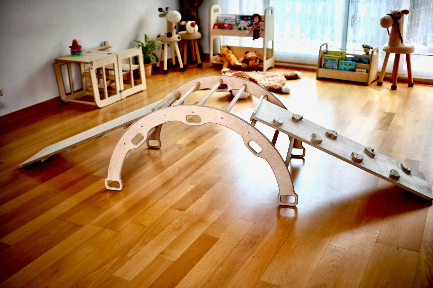 Child climbing on the Climbing Arch Rocker - Kidodido