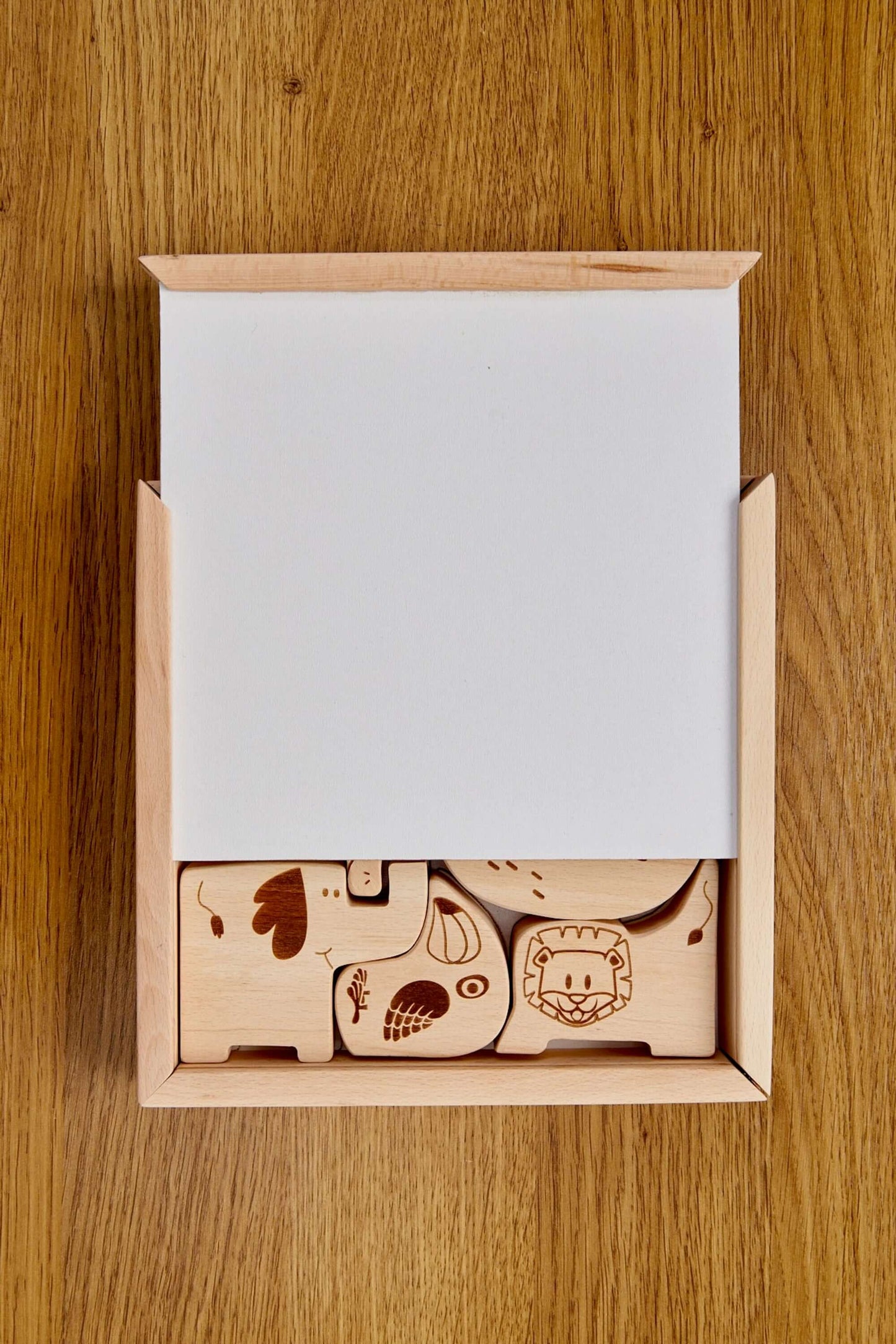 Wooden Safari Animal Puzzle Box for toddlers with beautifully crafted animal shapes inside.