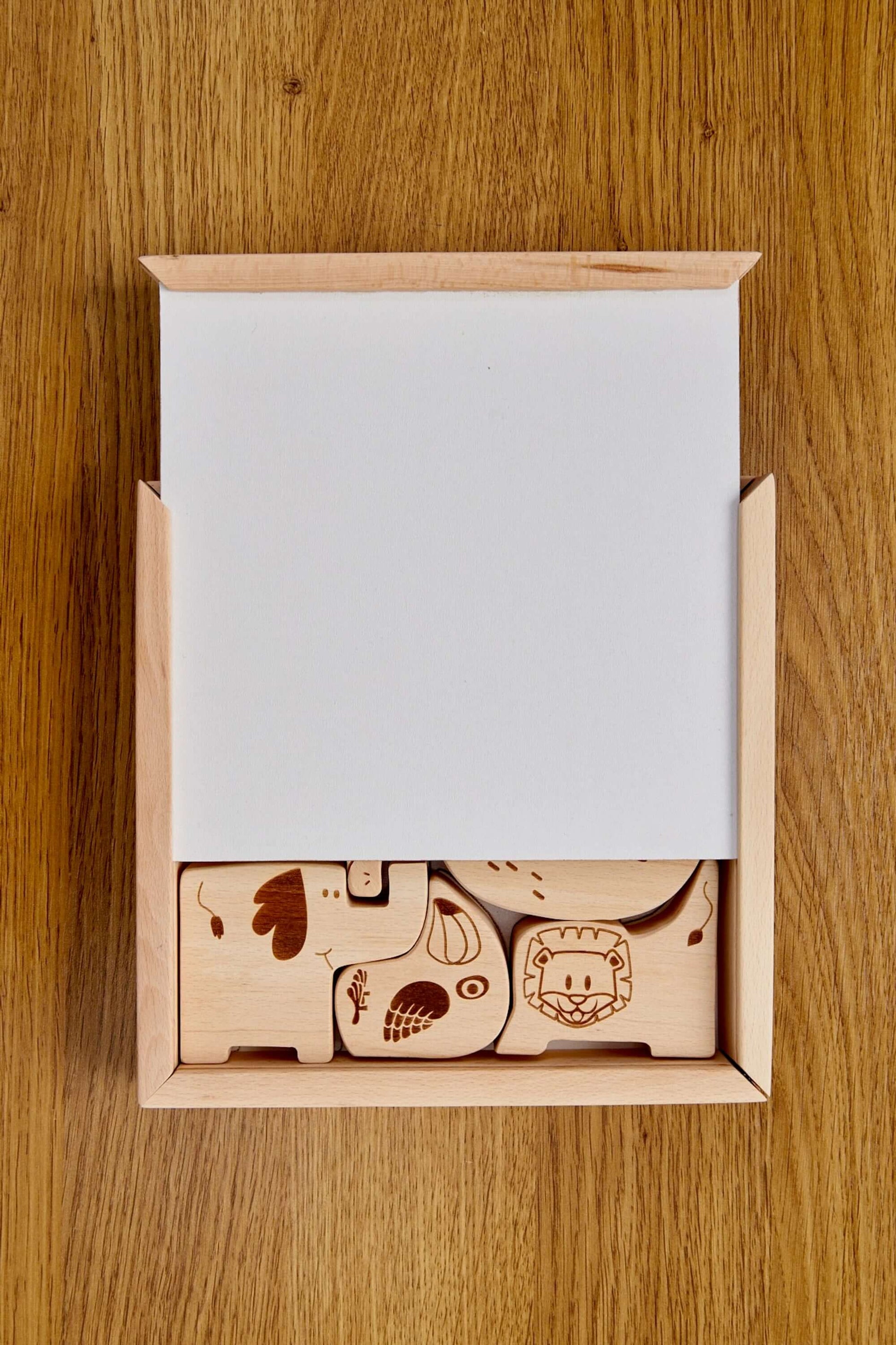 Wooden Safari Animal Puzzle Box for toddlers with beautifully crafted animal shapes inside.